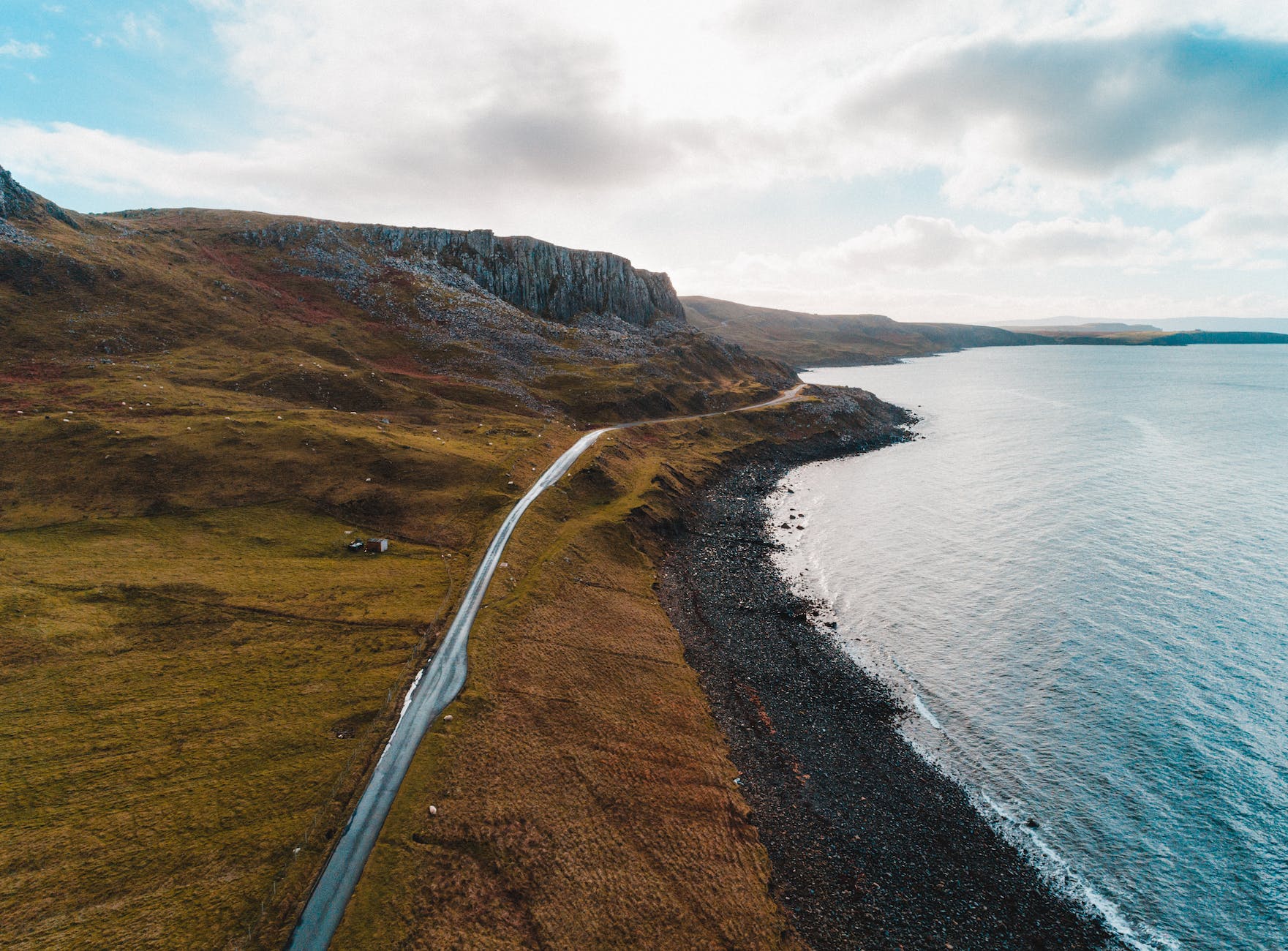 aerial photo of road near sea water